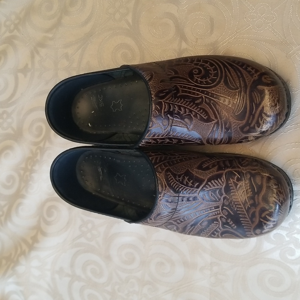 Dansko brown embossed floral clogs